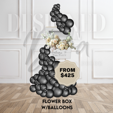 Floral box-style welcome sign featuring fresh or faux flowers and a coordinating balloon garland for a stunning first impression